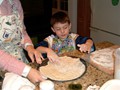 Helping with pizza dough